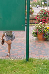 Full length of woman walking on flower