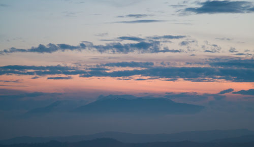 Scenic view of mountains against sky during sunset