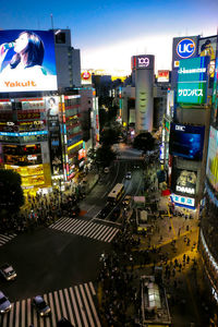 High angle view of traffic on road amidst buildings in city