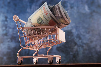 Close-up of miniature shopping cart