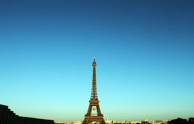 Eiffel tower against clear sky in city