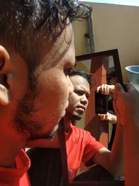 Portrait of young man using mobile phone