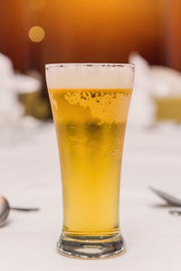 Close-up of beer in glass on table