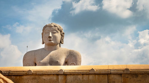 Gomatesawara statue with bright blue sky at morning