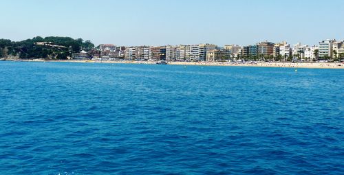 View of sea with buildings in background