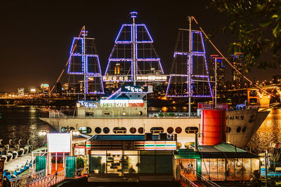 Illuminated buildings in city at night