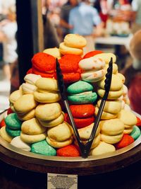 Close-up of multi colored macaroons for sale 
