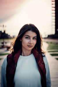 Portrait of beautiful young woman standing outdoors