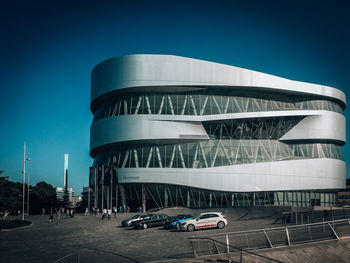 View of modern building against blue sky