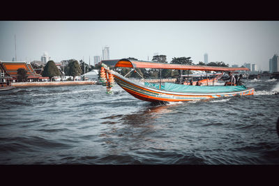 Boat in sea against clear sky