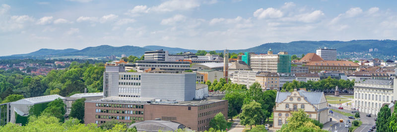 Buildings in town against sky