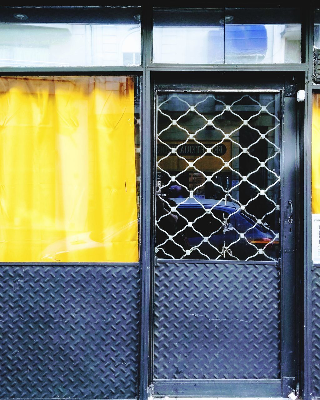 CLOSE-UP OF YELLOW WINDOW