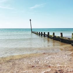 Scenic view of sea against blue sky