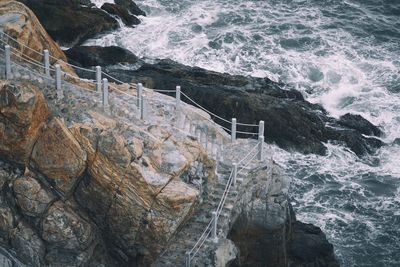 Stairs on cliff near ocean