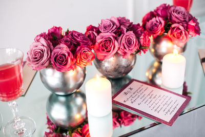 Close-up of pink roses on table