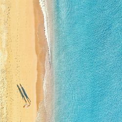 High angle view of surf on beach