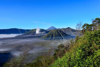 Scenic view of volcanic mountain against sky