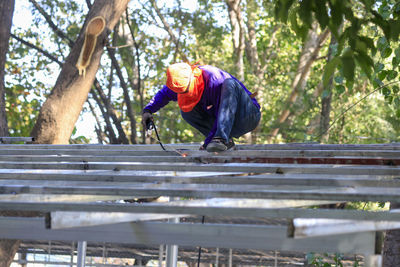 Welding the roof truss.welders working at dangerous heights. welding of steel is very technically 