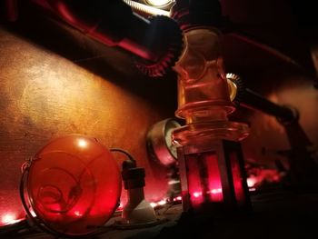 Close-up of illuminated candles on table