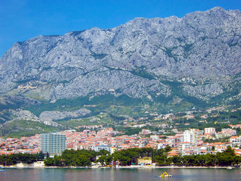 Scenic view of sea and buildings against sky