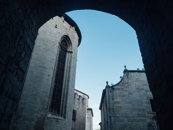 Low angle view of old building against clear sky