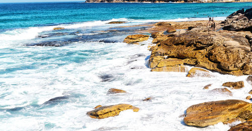 Scenic view of rocks on beach