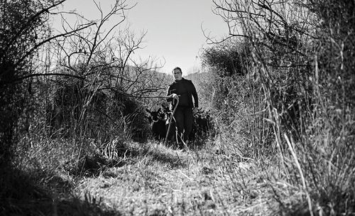 People walking on grassy field