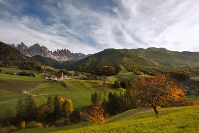 Scenic view of landscape and mountains against sky