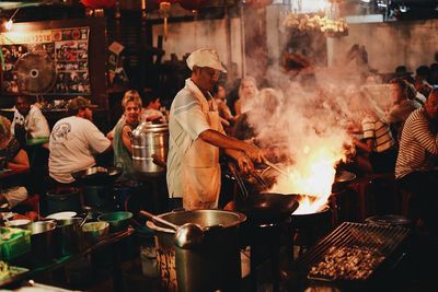 Group of people at restaurant market