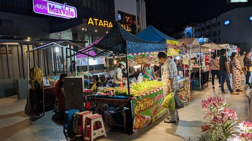 People at market stall