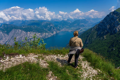 Rear view of man standing on mountain