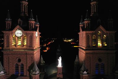 Illuminated buildings in city at night