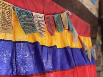 Close-up of multi colored clothes hanging at market stall