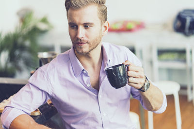 Man having coffee at cafe