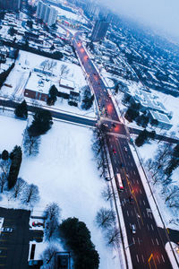 High angle view of street amidst buildings during winter