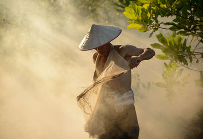 Man adjusting fishing net