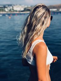 Side view of woman looking at sea