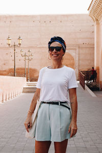 Portrait of woman standing on street