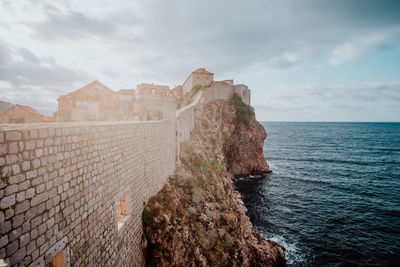 Scenic view of sea against cloudy sky