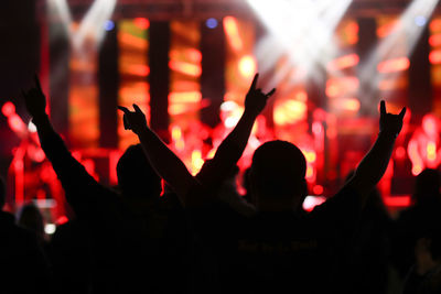 Silhouette people at music concert