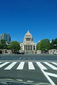 View of road against clear blue sky