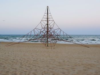 Scenic view of beach against clear sky