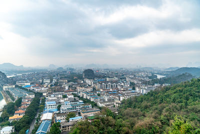 High angle view of buildings in city against sky