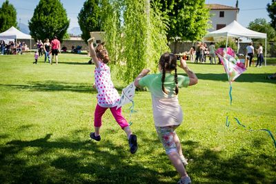 People playing soccer in park