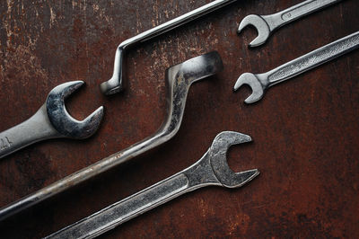 Close-up of work tool over rusty metal