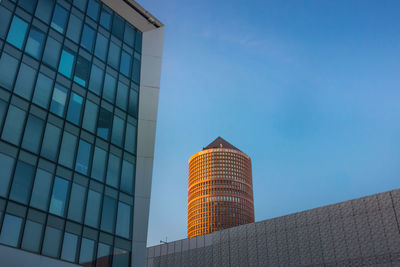 Low angle view of modern buildings against clear sky