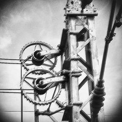 Low angle view of metal pole against sky