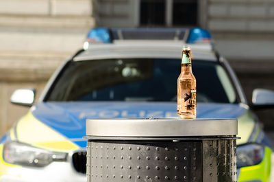 Close-up of wine bottle against blue background