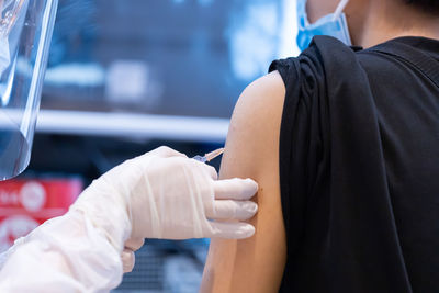 Rear view of couple holding hands