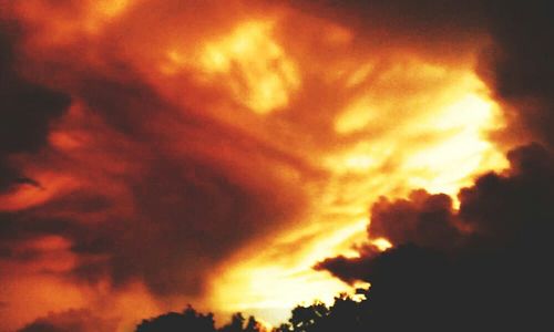 Low angle view of cloudy sky at sunset